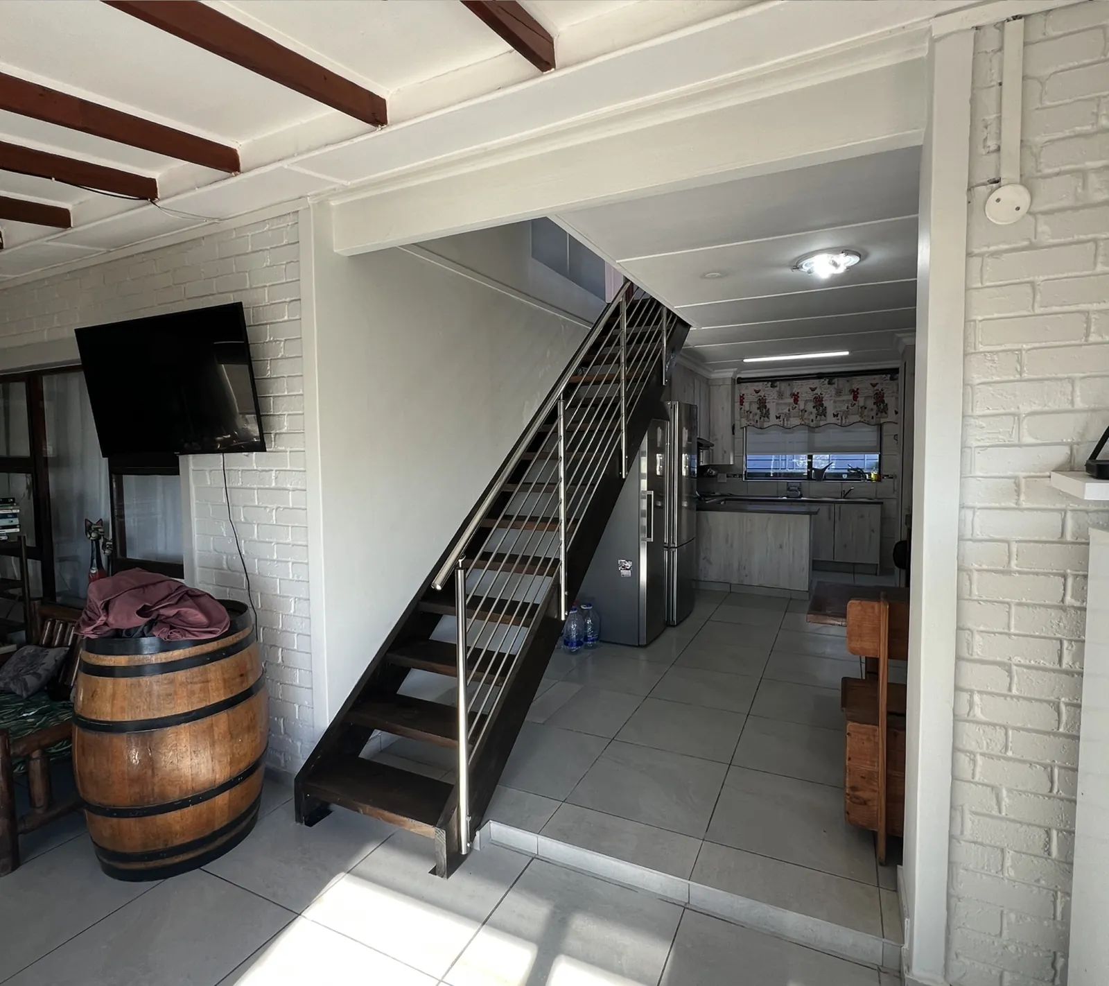 After: new timber staircase with stainless steel balustrade