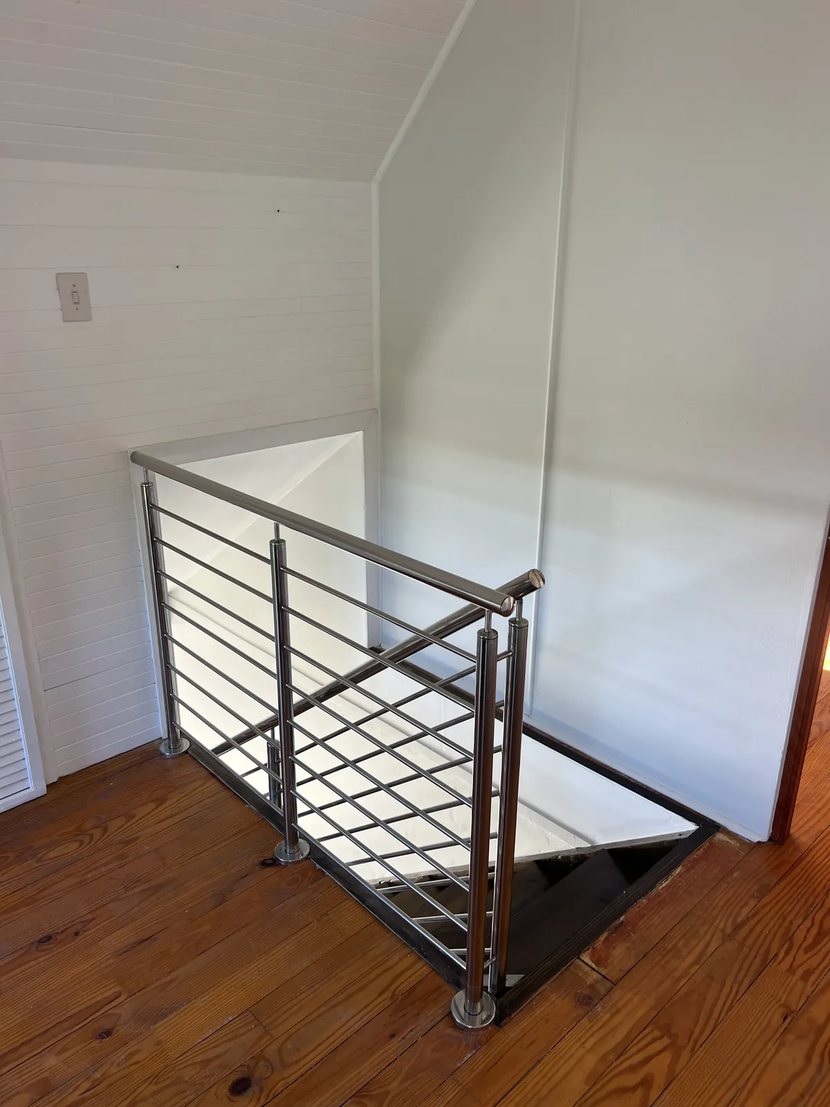 Stainless steel balustrade around the new stair opening upstairs