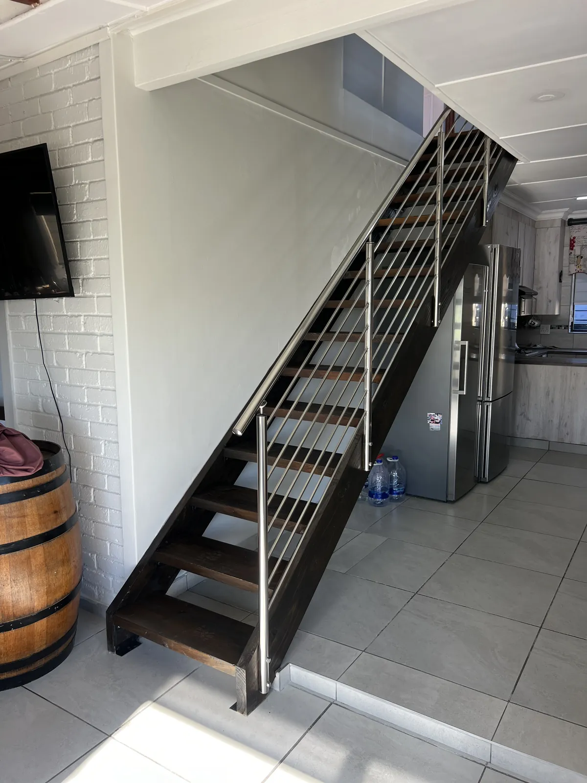 New open-tread timber staircase with stainless steel balustrade