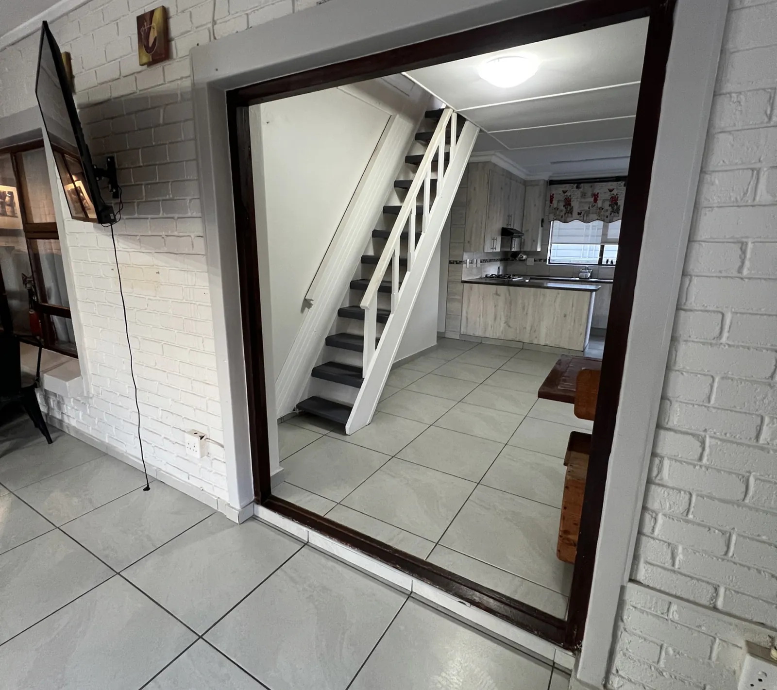 Before: steep painted timber staircase