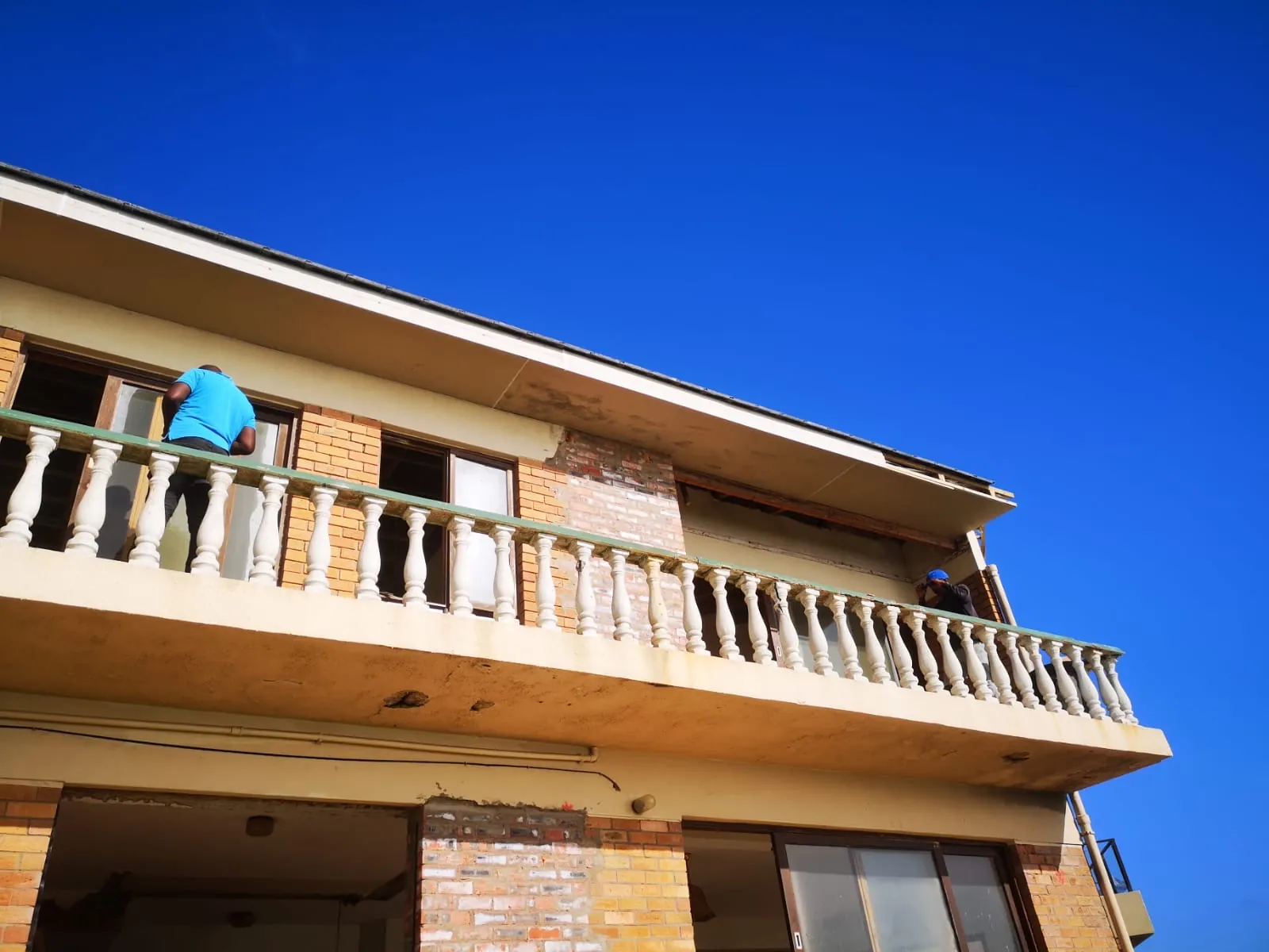 Before: the old balcony with concrete balustrades