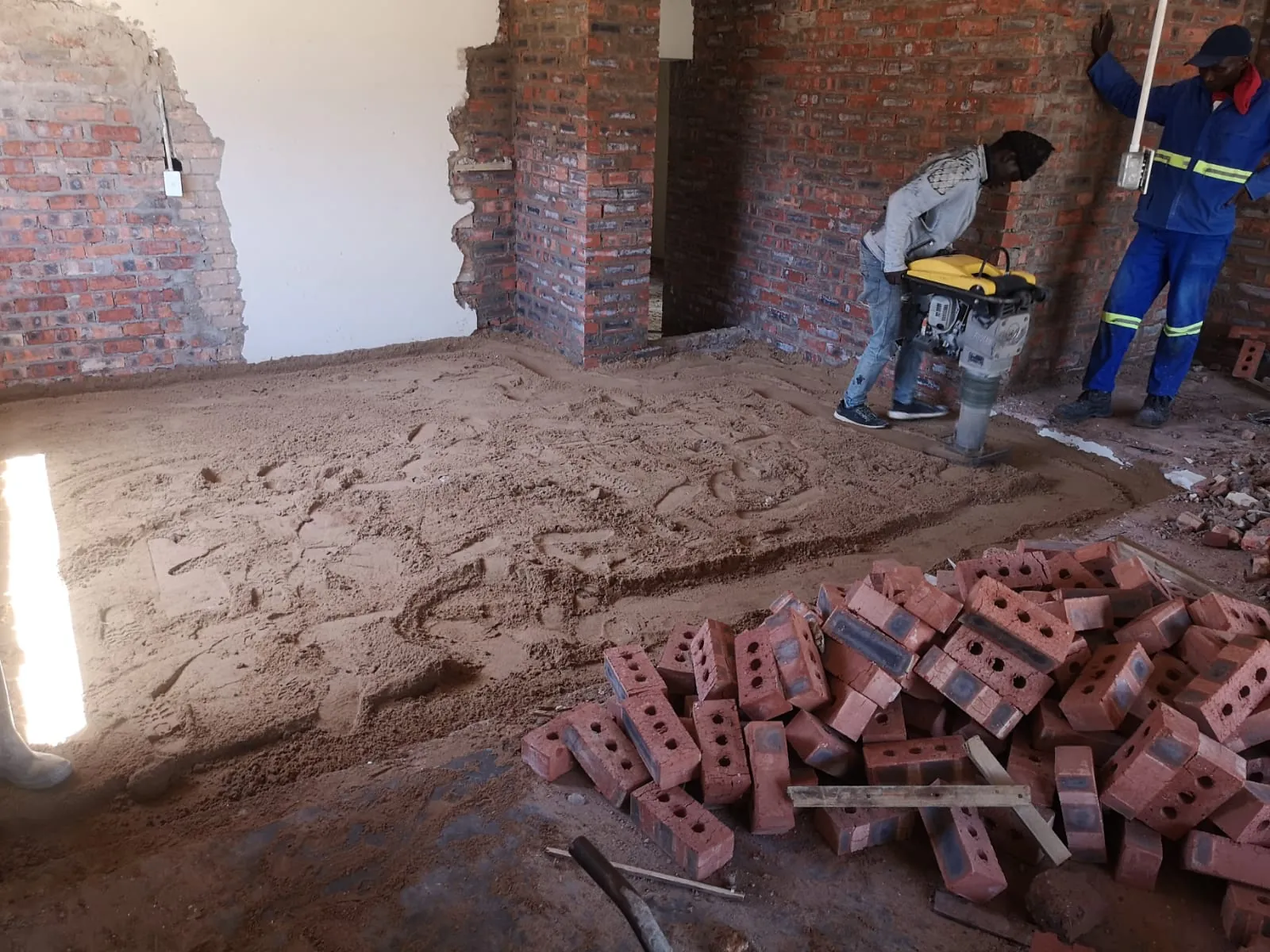 Compacting the fill for the new floor