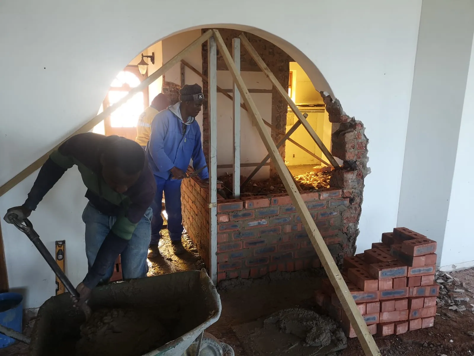 Building new walls through the old archway
