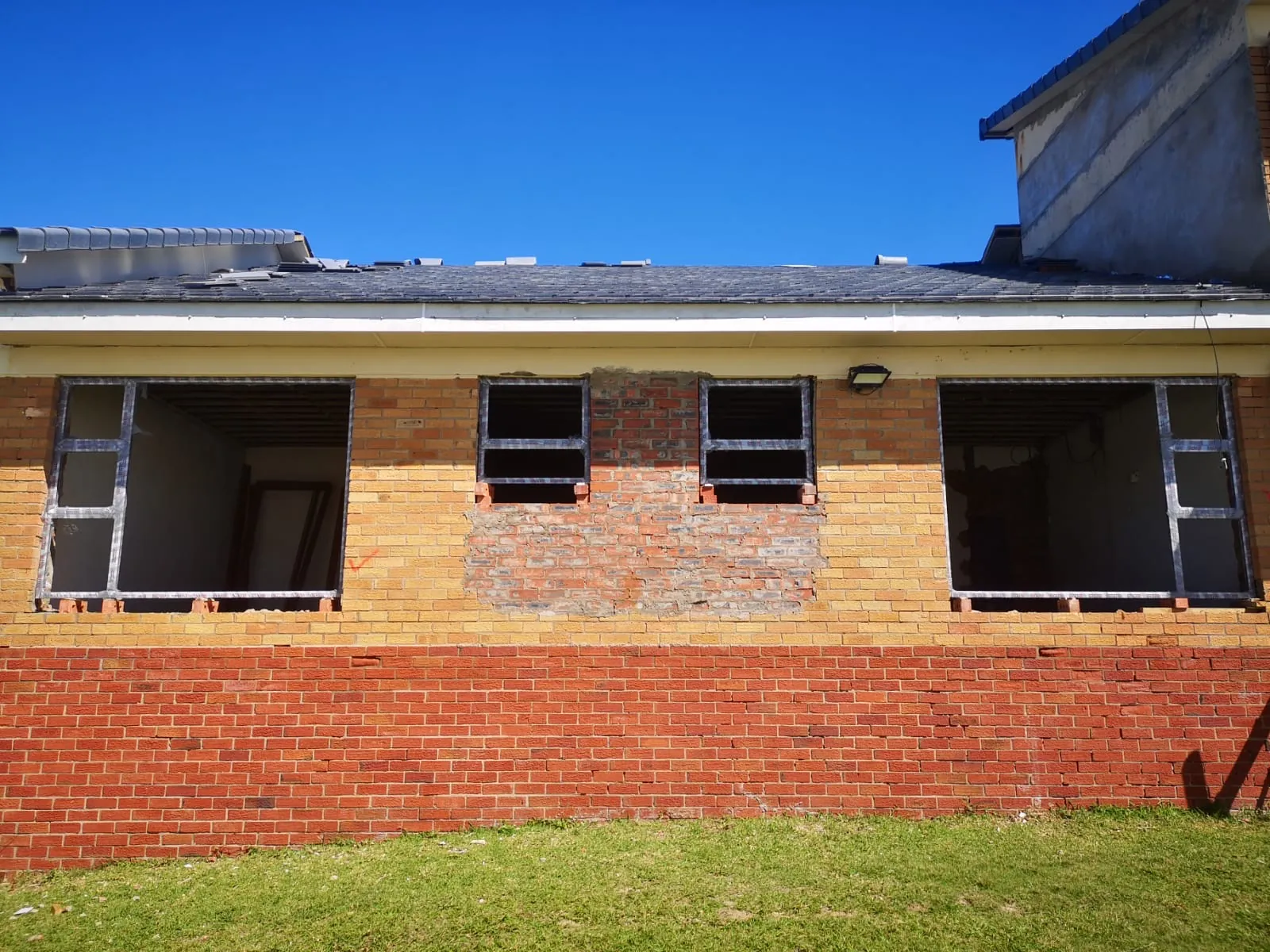 Old windows bricked up and new openings made at the back