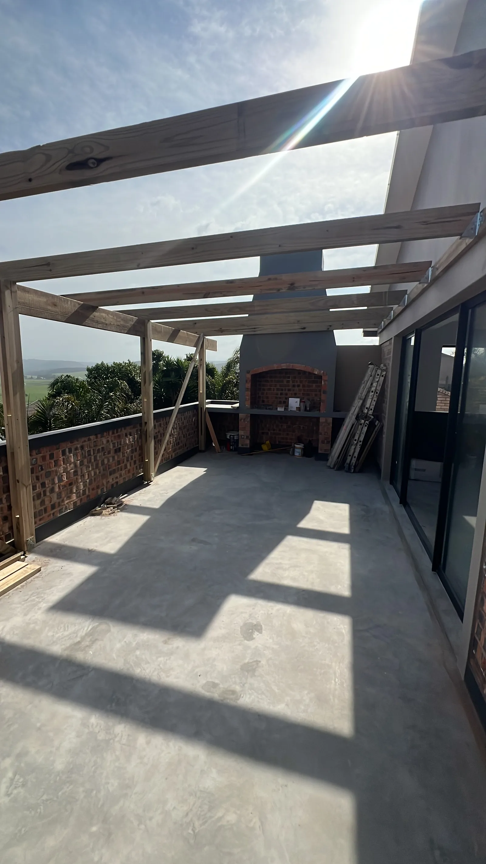 Timber beams going up over the balcony