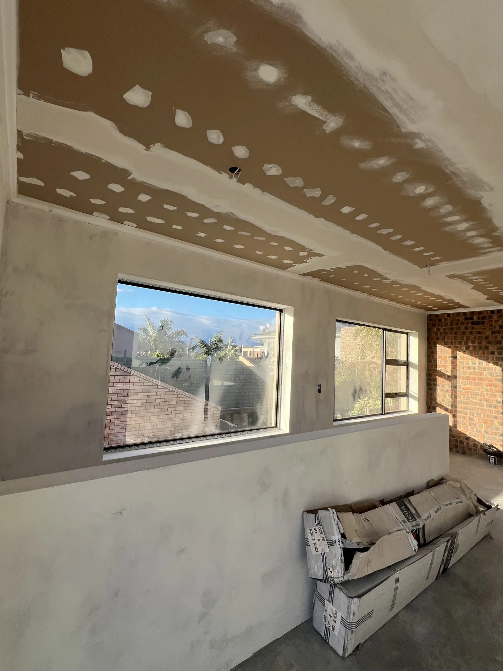 Ceilings boarded and taped, with the walls plastered