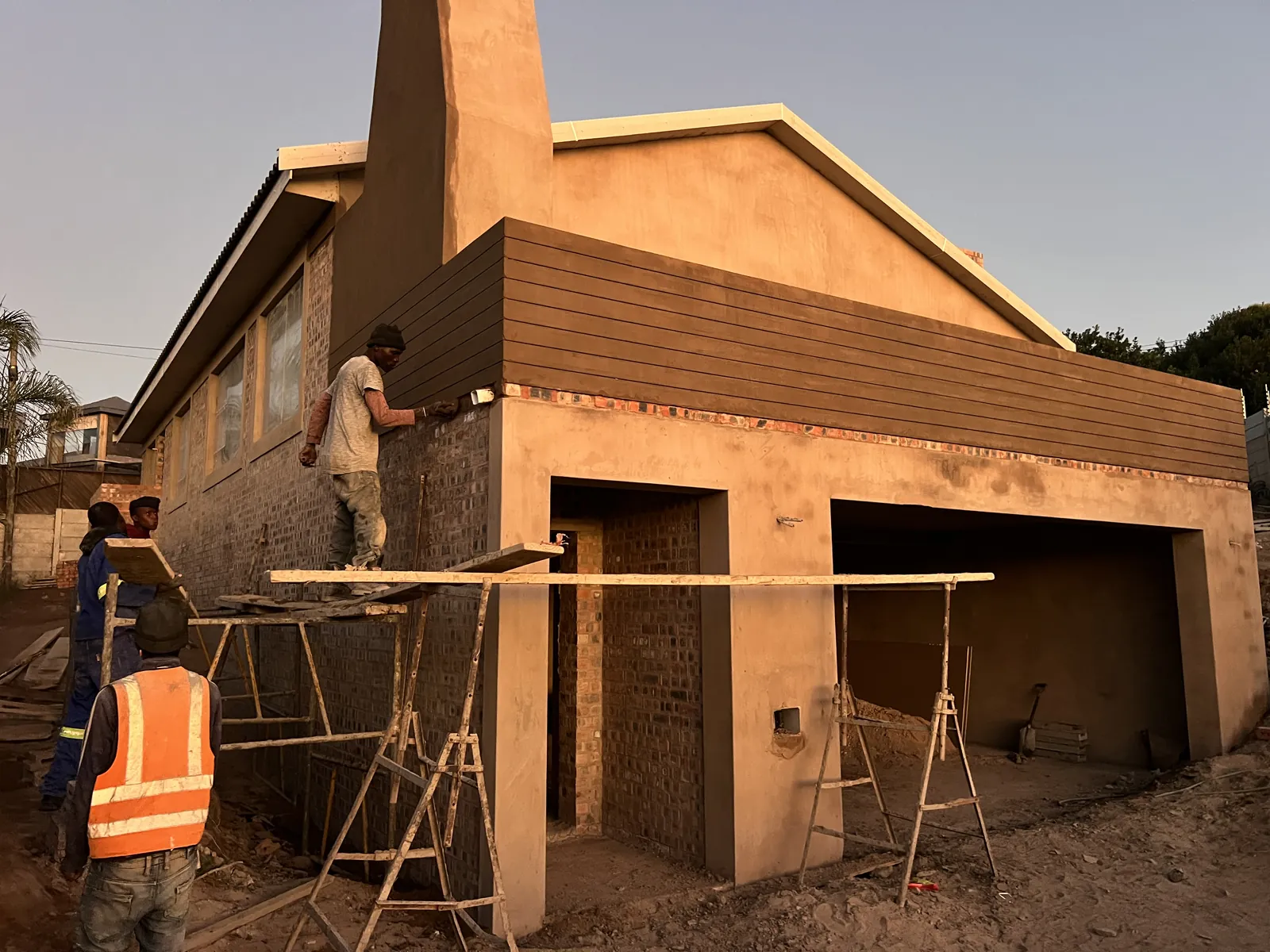 Plastering the walls, including the grooved finish upstairs