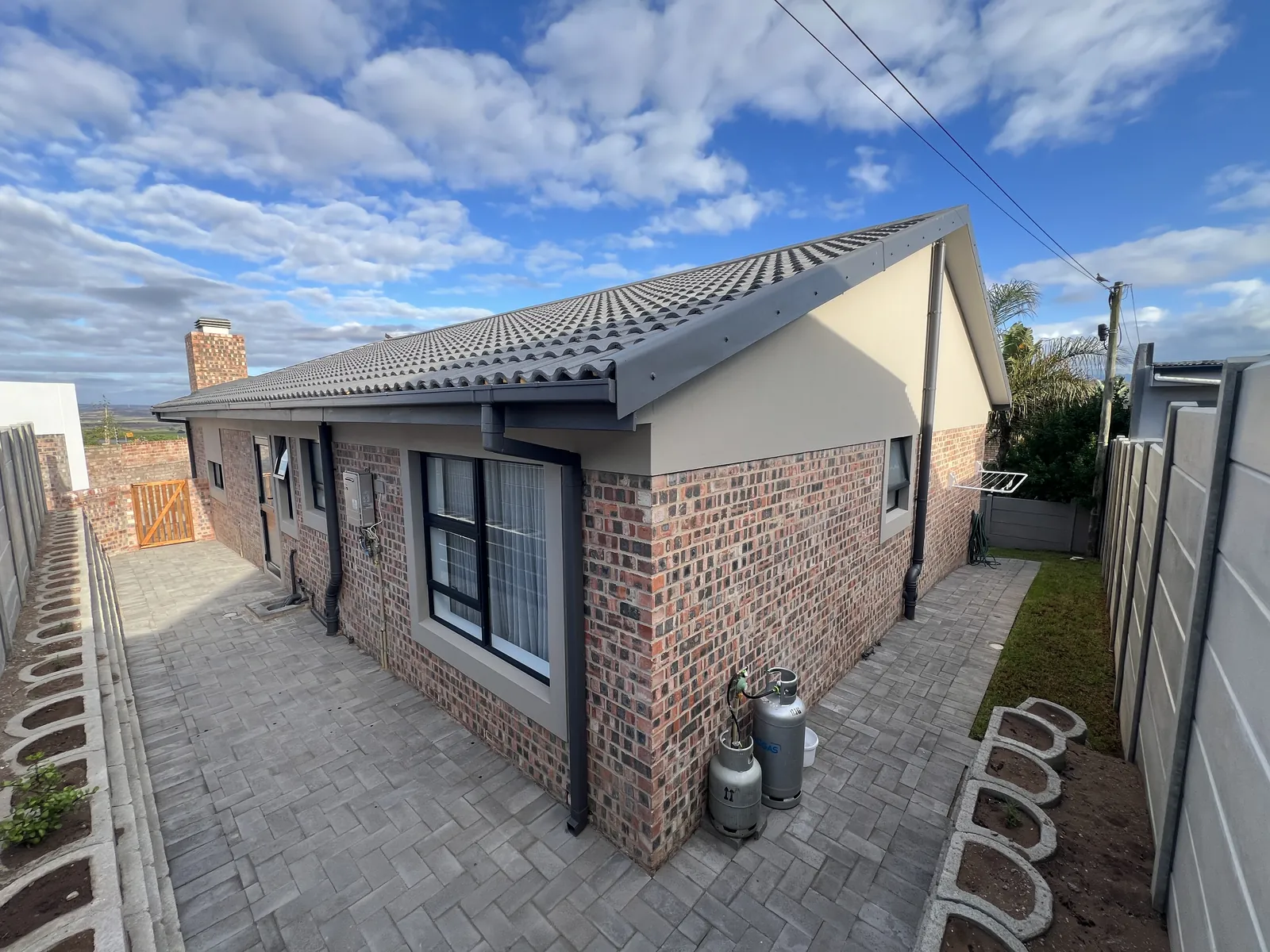 Rear of the new home with paving