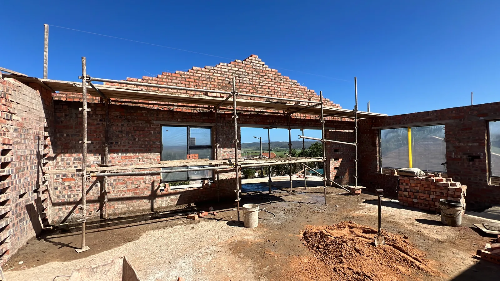Upstairs walls and gable going up on the new slab