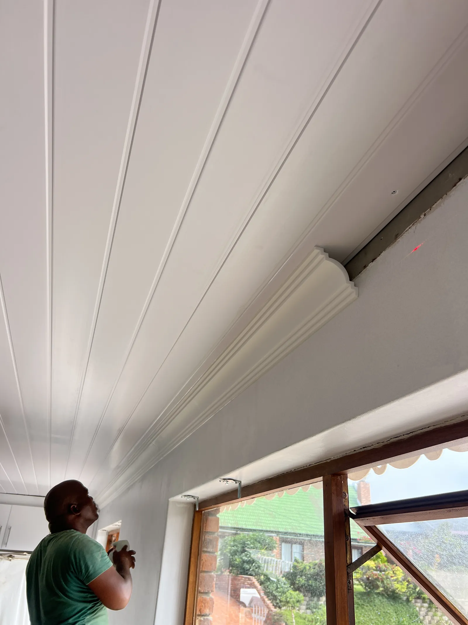 Fitting the new cornices along the PVC ceiling
