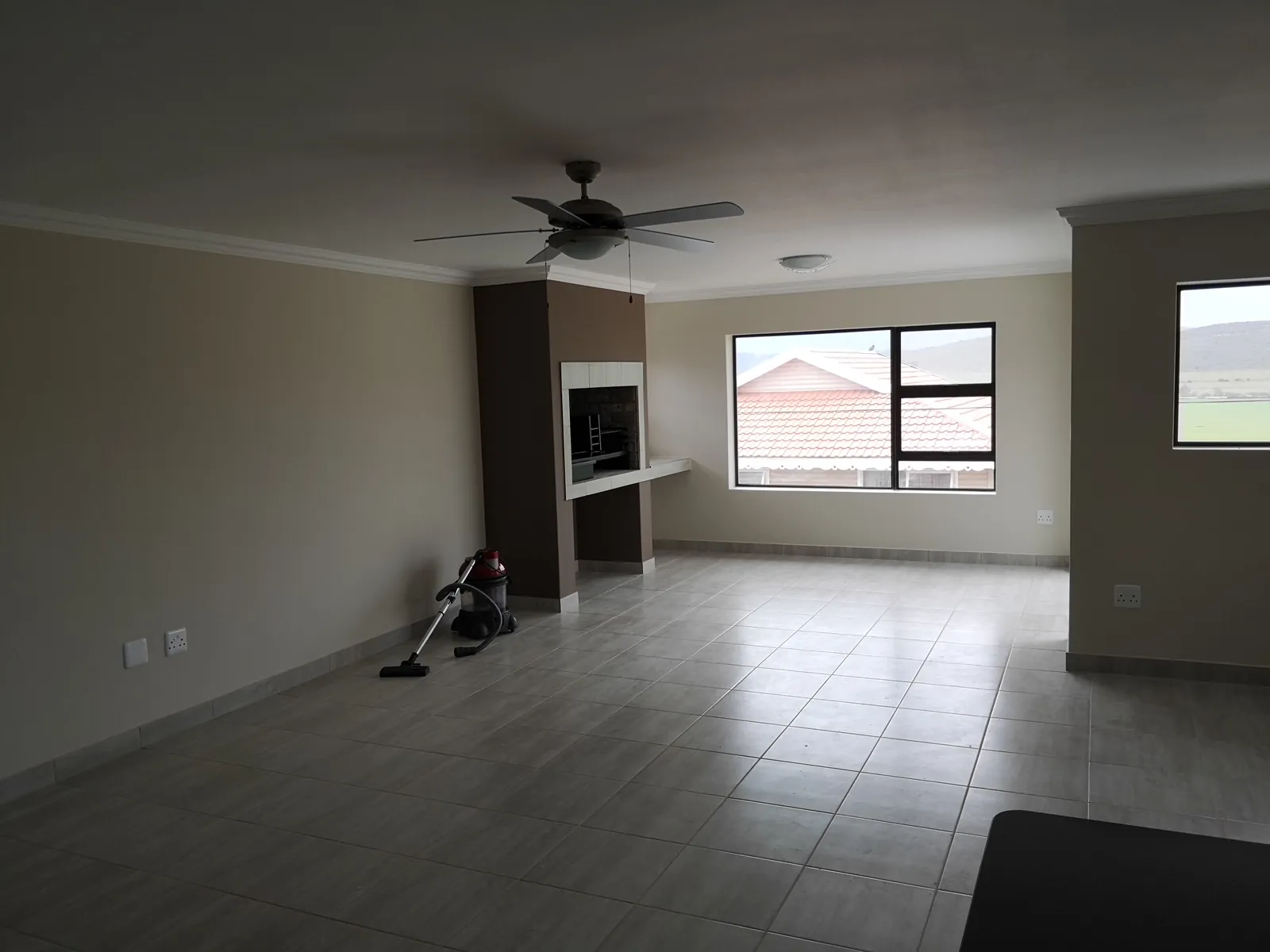 Open-plan living area with indoor braai