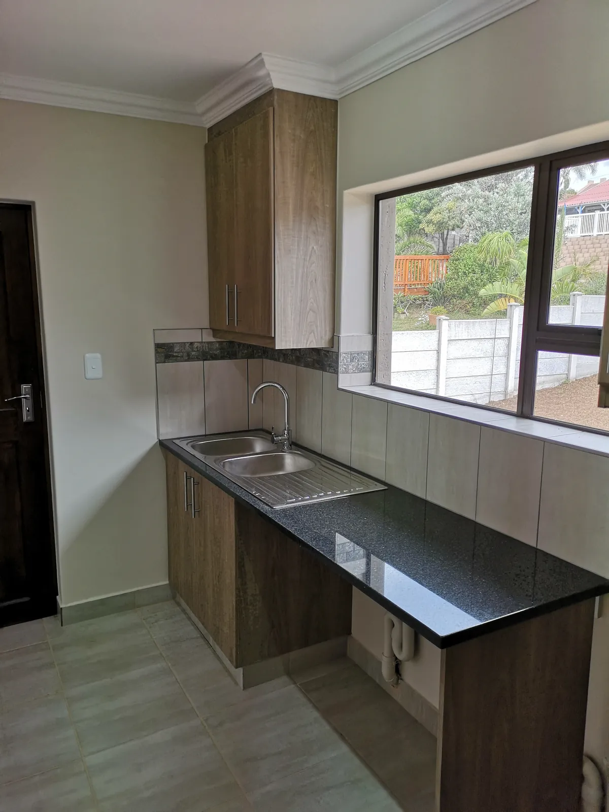 Scullery with granite top and double sink