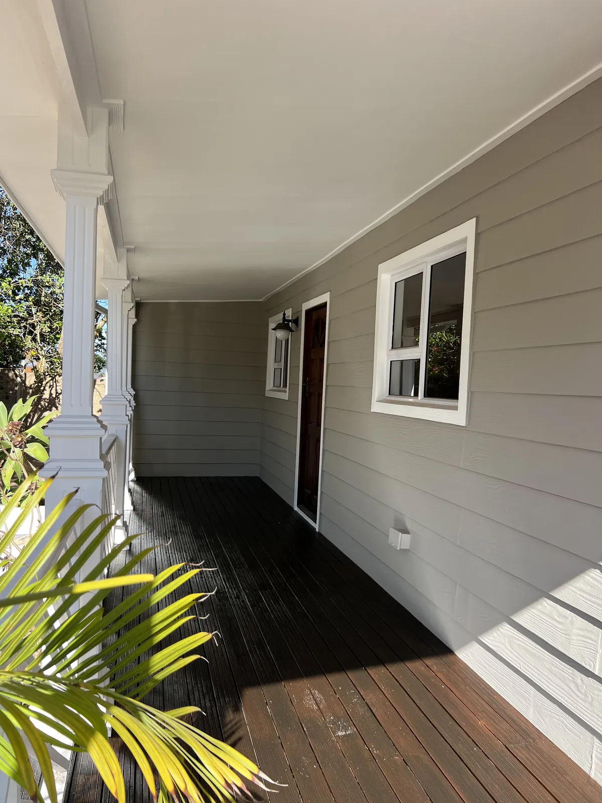 Veranda after painting: walls, ceiling, columns and window frames