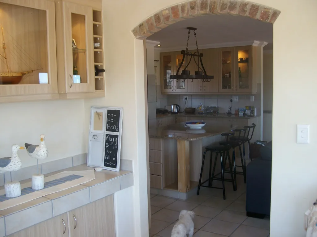 Face-brick archway through to the kitchen