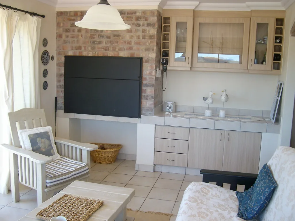 Living area with indoor braai and built-in cabinets