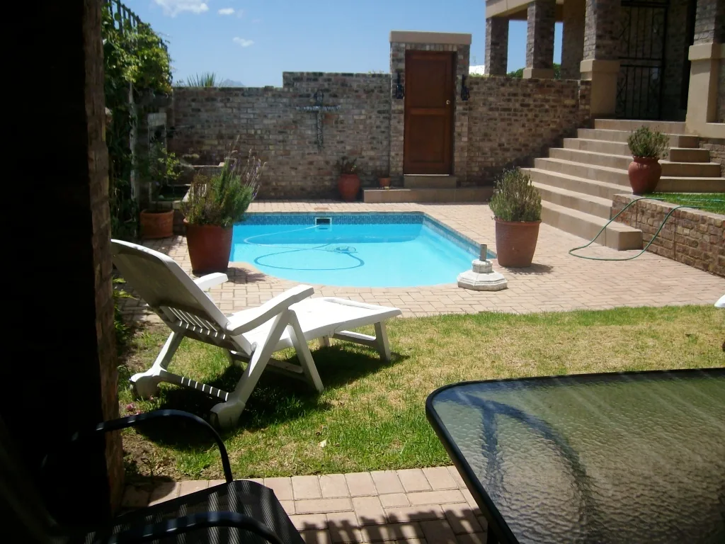 Pool area with steps up to the house