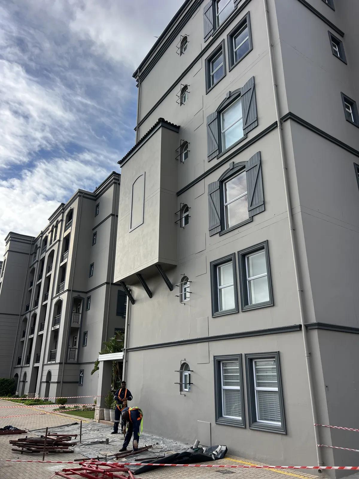 After: cladding removed, plastered and painted to match the building
